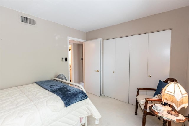 carpeted bedroom featuring a closet