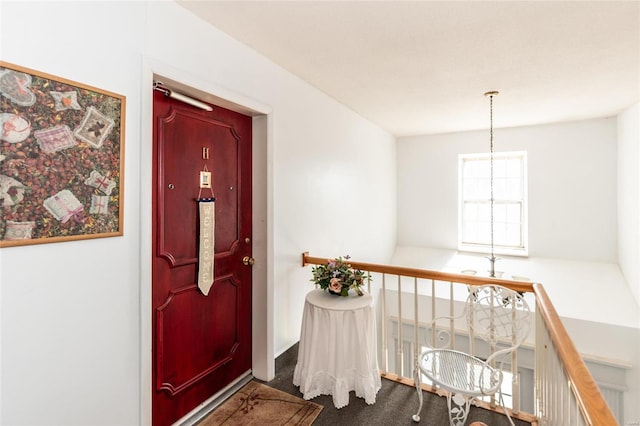 entryway featuring carpet floors