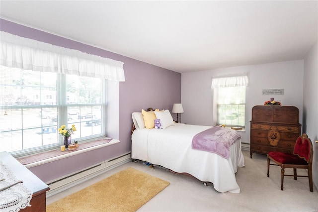 carpeted bedroom featuring baseboard heating