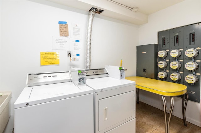 laundry area with tile patterned floors and washer and dryer