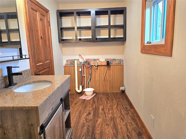 bathroom with vanity and hardwood / wood-style floors