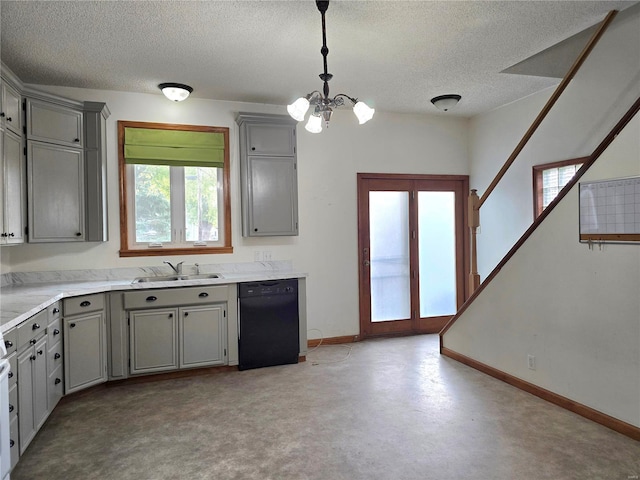 kitchen with black dishwasher, hanging light fixtures, sink, gray cabinets, and a textured ceiling