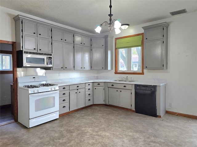 kitchen featuring white range with gas cooktop, black dishwasher, hanging light fixtures, a notable chandelier, and sink