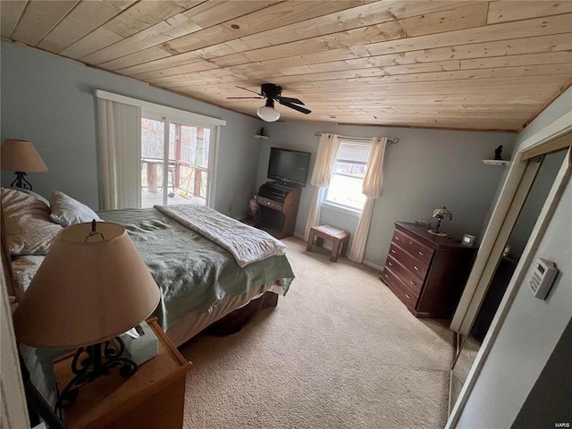 carpeted bedroom with wooden ceiling and ceiling fan