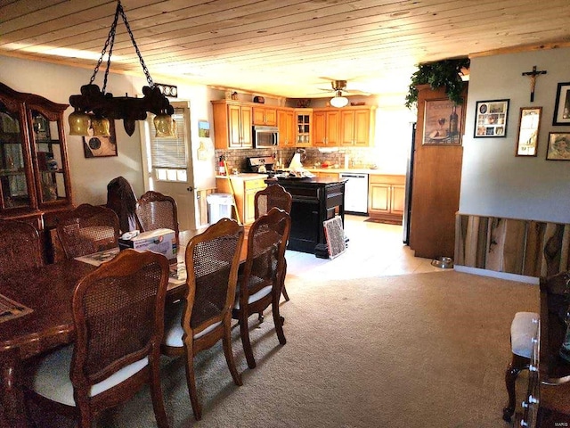 dining room with light carpet, wooden ceiling, and ceiling fan