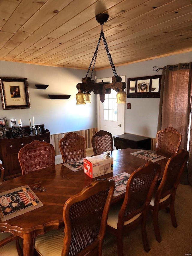 dining area featuring hardwood / wood-style floors and wooden ceiling