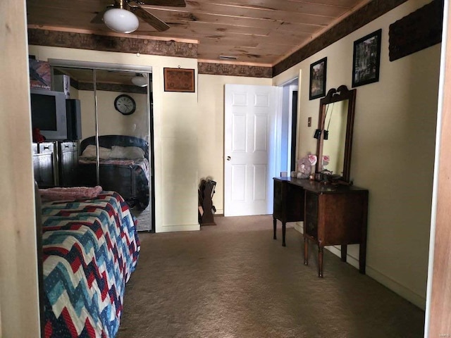 carpeted bedroom featuring wooden ceiling