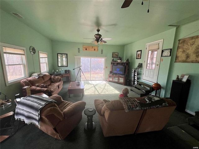 carpeted living room with ceiling fan