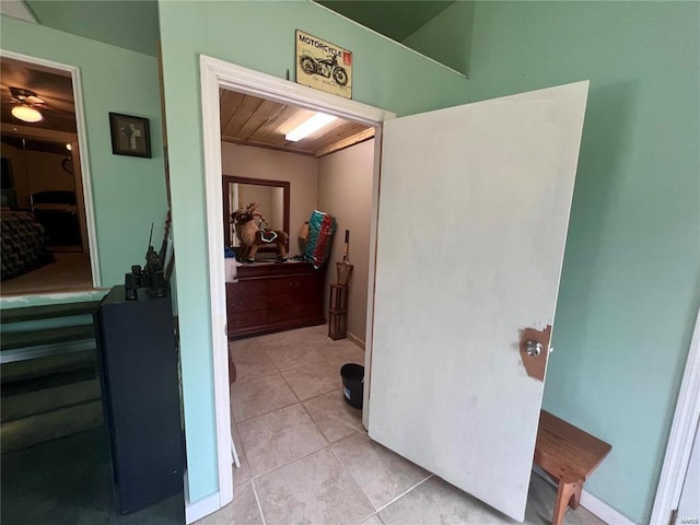 hallway featuring light tile patterned floors