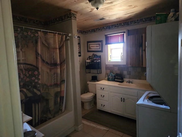 full bathroom featuring tile patterned floors, toilet, washer / dryer, wooden ceiling, and vanity