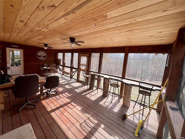 unfurnished sunroom featuring wooden ceiling