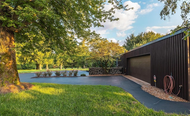 garage with aphalt driveway