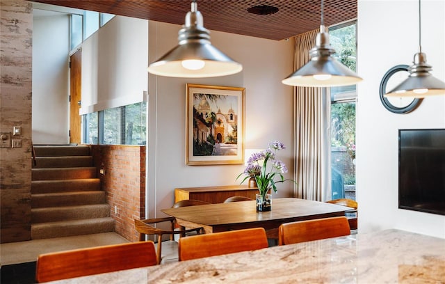 dining space featuring wood ceiling