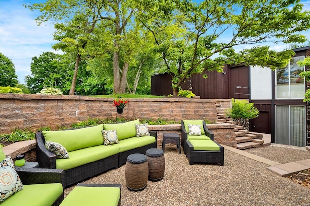 view of patio with fence and an outdoor living space