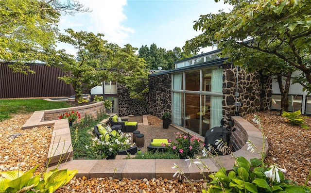 view of yard featuring an outdoor living space and a patio area