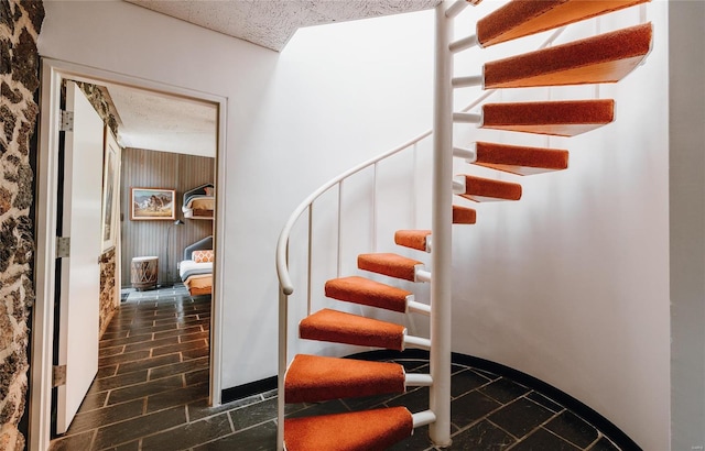 staircase featuring tile patterned floors