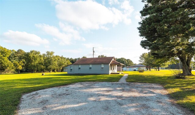 view of property exterior with a lawn