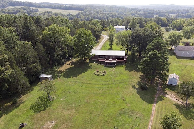 birds eye view of property with a rural view