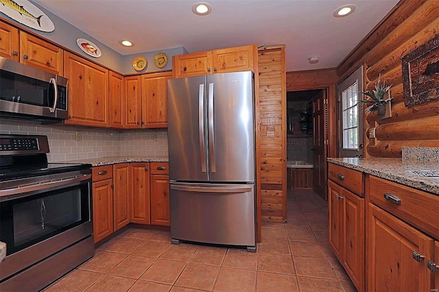 kitchen featuring appliances with stainless steel finishes, recessed lighting, log walls, and decorative backsplash