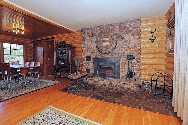 living area featuring a fireplace and hardwood / wood-style floors