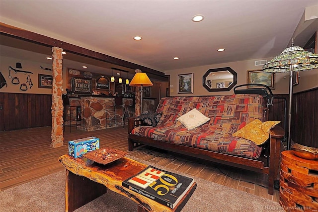 living area with wainscoting, visible vents, wood finished floors, and recessed lighting