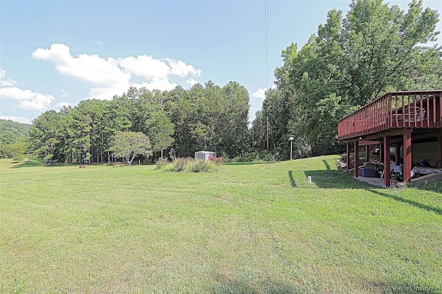 view of yard featuring a wooden deck