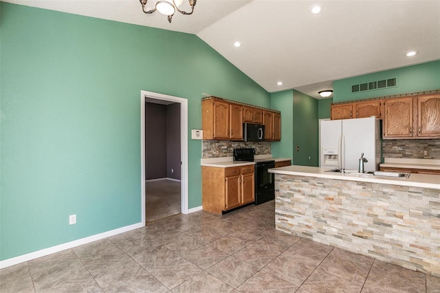 kitchen with white fridge with ice dispenser, black range with electric stovetop, sink, vaulted ceiling, and decorative backsplash