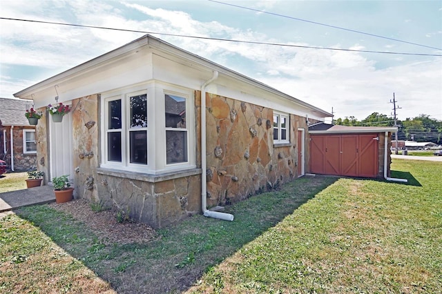 view of property exterior with a shed and a lawn