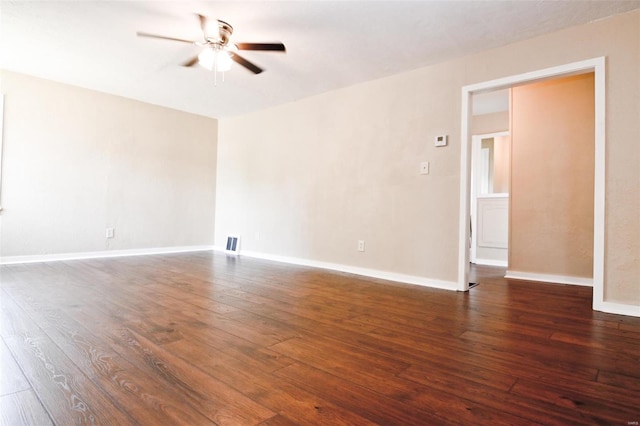 empty room featuring hardwood / wood-style floors and ceiling fan