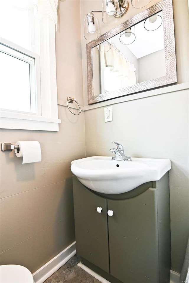 bathroom featuring vanity, toilet, and tile patterned flooring