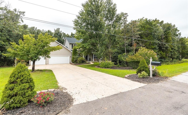 view of property hidden behind natural elements featuring a garage, a front lawn, and concrete driveway