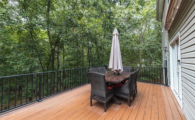 wooden deck with outdoor dining space