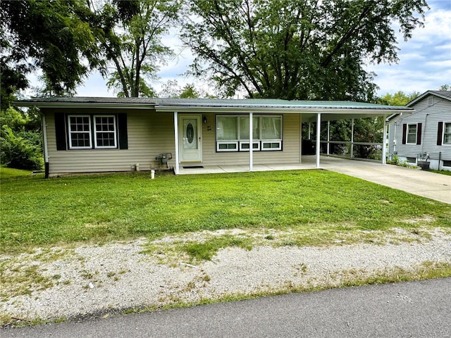 single story home with a front lawn and a carport