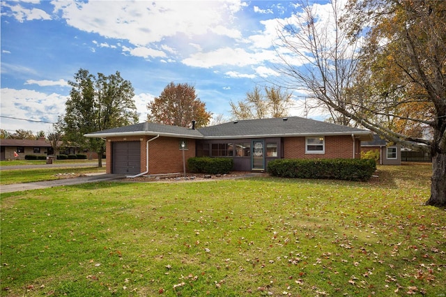 ranch-style house with a garage and a front yard