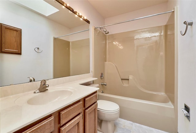 bathroom featuring a skylight, shower / bath combination, toilet, vanity, and tile patterned flooring