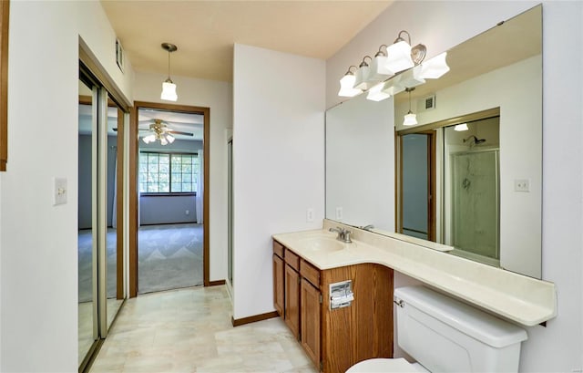 bathroom featuring baseboards, visible vents, a shower, toilet, and vanity