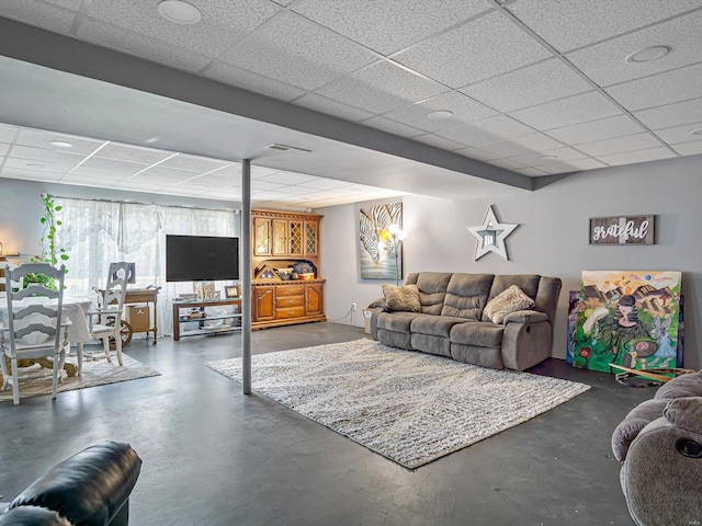 living room featuring a paneled ceiling