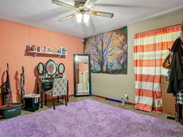 misc room featuring ceiling fan and carpet