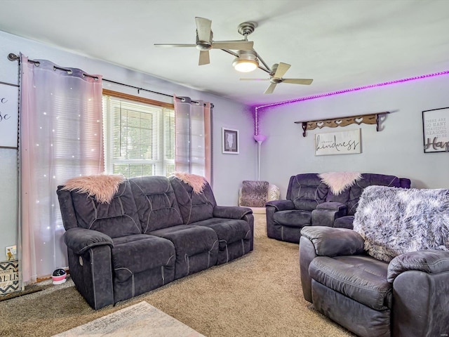 living room with ceiling fan and carpet