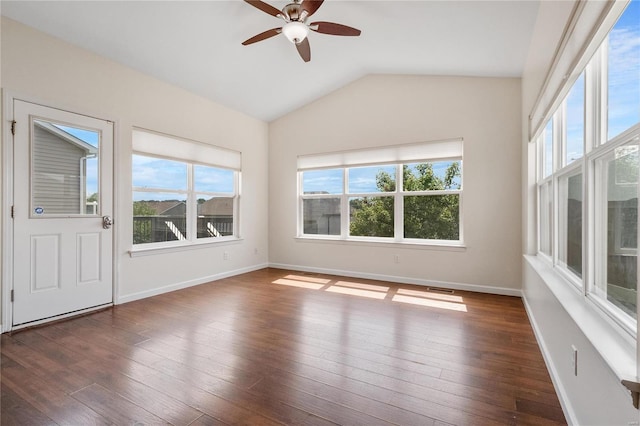 unfurnished sunroom with ceiling fan, plenty of natural light, and lofted ceiling