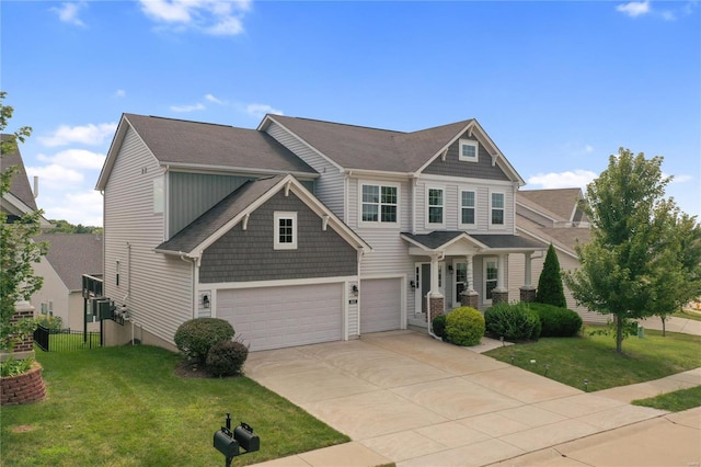 craftsman inspired home featuring a garage, concrete driveway, a front yard, and fence