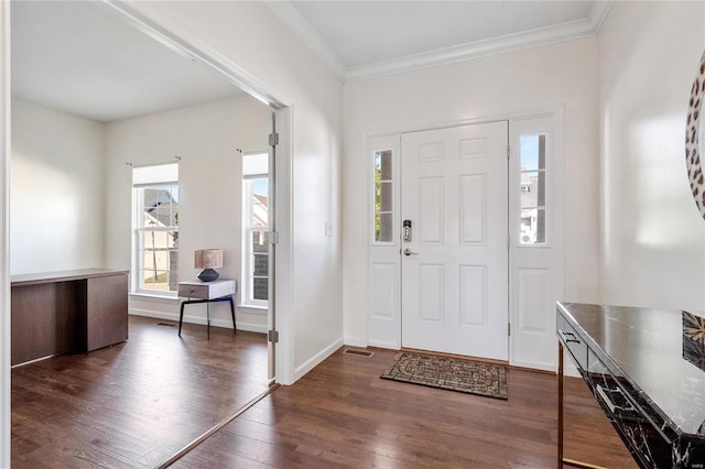 foyer entrance with dark hardwood / wood-style floors and ornamental molding