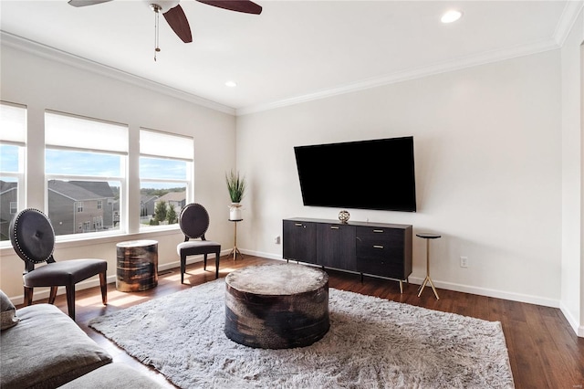 living room featuring ceiling fan, dark hardwood / wood-style flooring, and ornamental molding