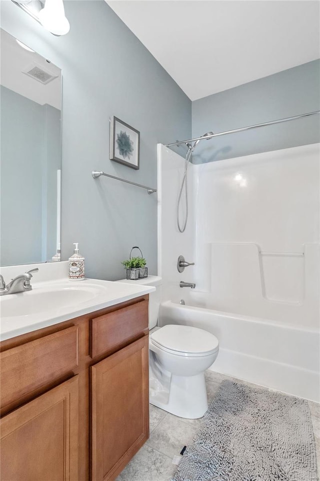 full bathroom featuring tile patterned floors, vanity, shower / bath combination, and toilet