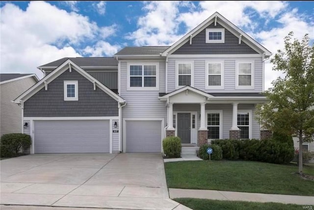 craftsman house featuring a front lawn and a garage