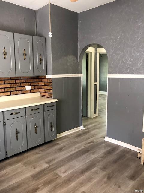 kitchen featuring gray cabinets and light wood-type flooring