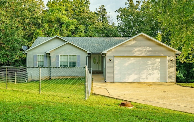 ranch-style house featuring a garage and a front lawn