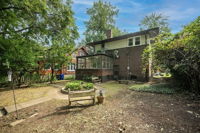 back of property featuring a sunroom