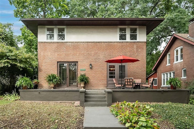 view of front of property featuring a patio and french doors