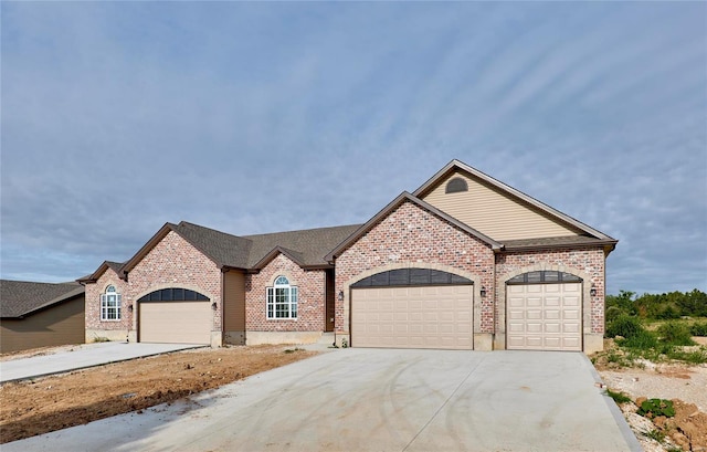 french country home featuring a garage